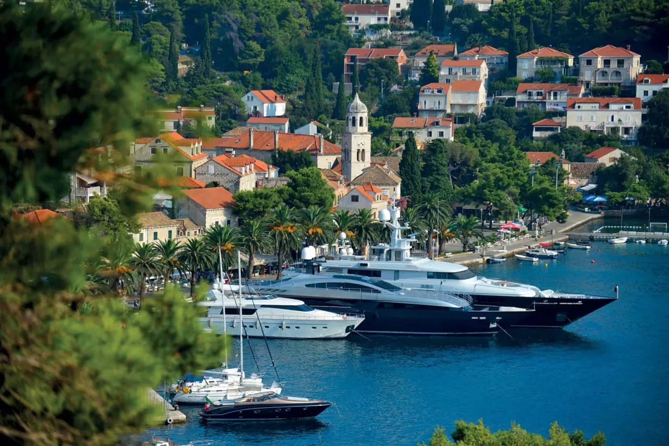Cavtat promenade with yachts at sunset