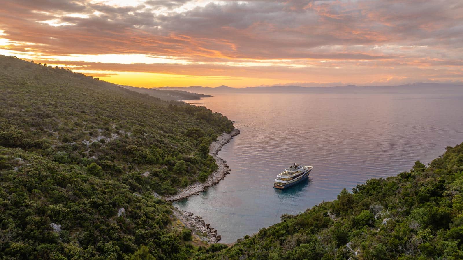 Yacht at sunset in a calm Adriatic anchorage