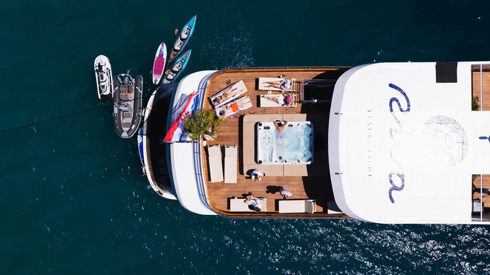 Riva yacht anchored with water toys in Croatia